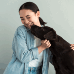 dog-kissing-woman