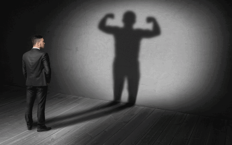 man-standing-with-his-own-shadow