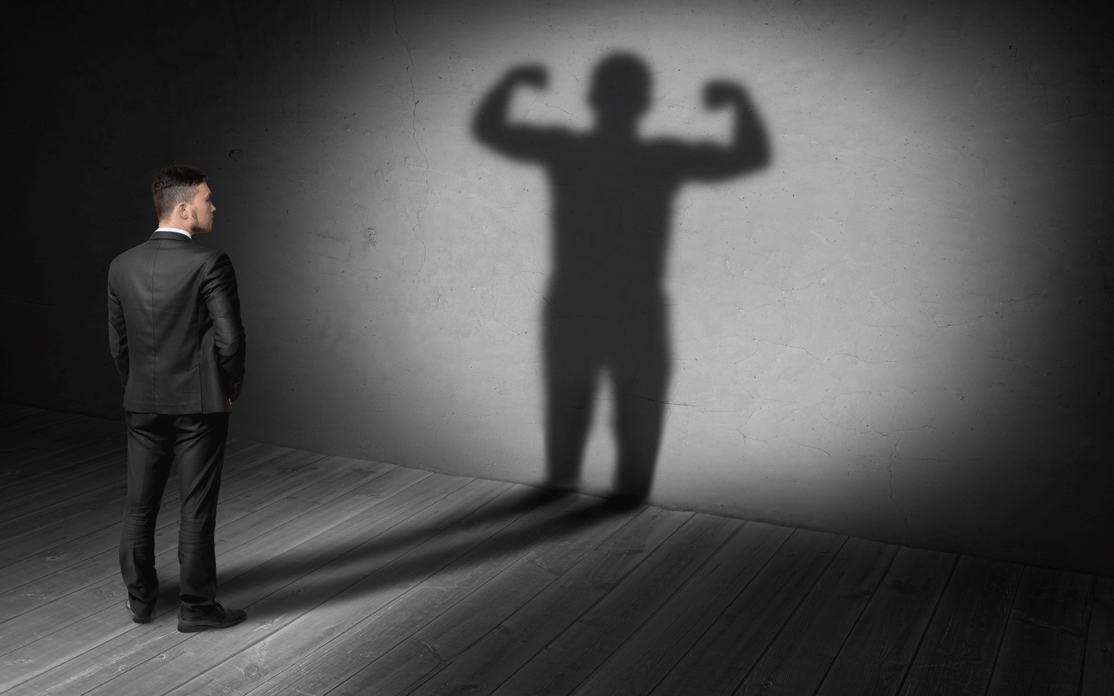 man-standing-with-his-own-shadow